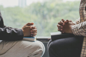 Two men praying together