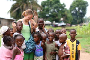 Female missionary with group of kids