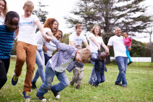 Group parishioners playing games in park