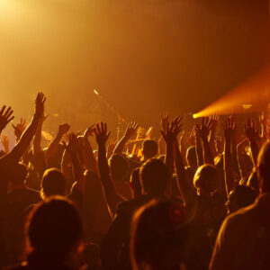 Large congregation hands up in worship
