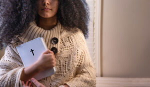 Teen girl holding bible