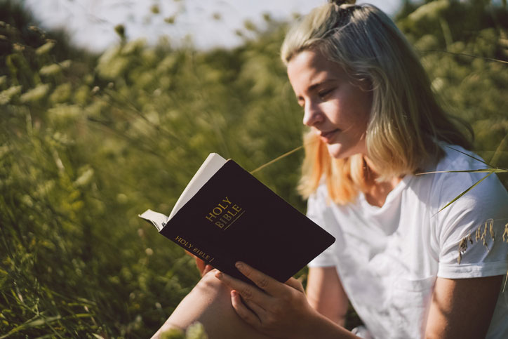 Biblical languages degree student reading bible
