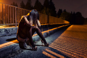 Desperate young woman on bridge in need