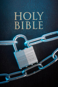 Holy Bible locked with chain and lock