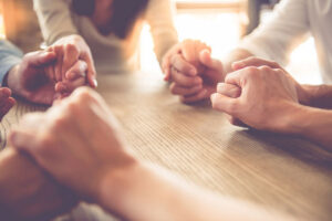 Prayers together holding hands