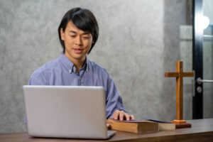 Praying online with bible and computer