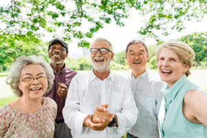 Senior group smiling together outside