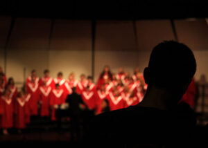 Silhouette enjoying church choir performance