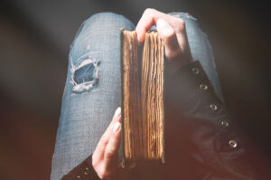 Woman holding ancient bible