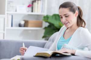 Young woman studying bible