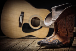 Country music - boots, hat, and guitar