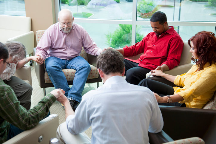 diverse church group in prayer