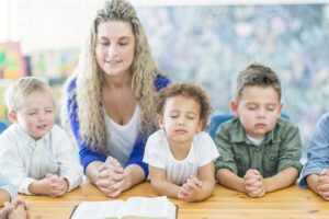 Praying in Sunday School with kids