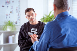 young man with psychologist christian counselor