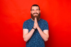 Smiling bearded man praying
