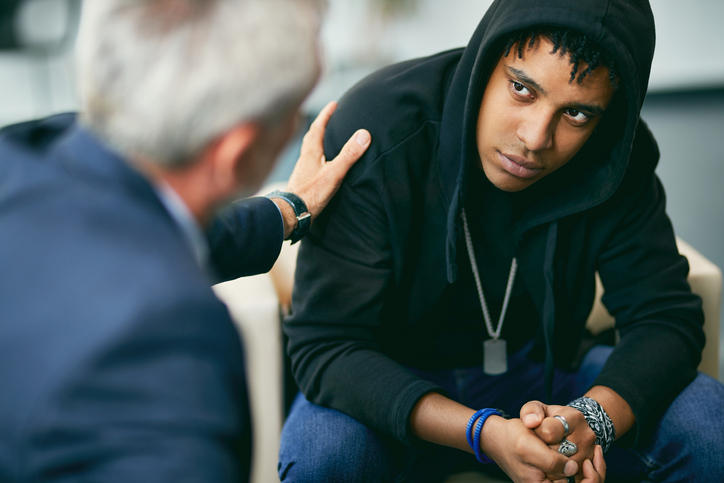 pastor helping troubled young man