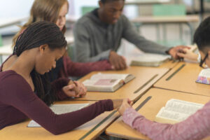 students praying together