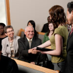 A new couple being welcomed to a church service