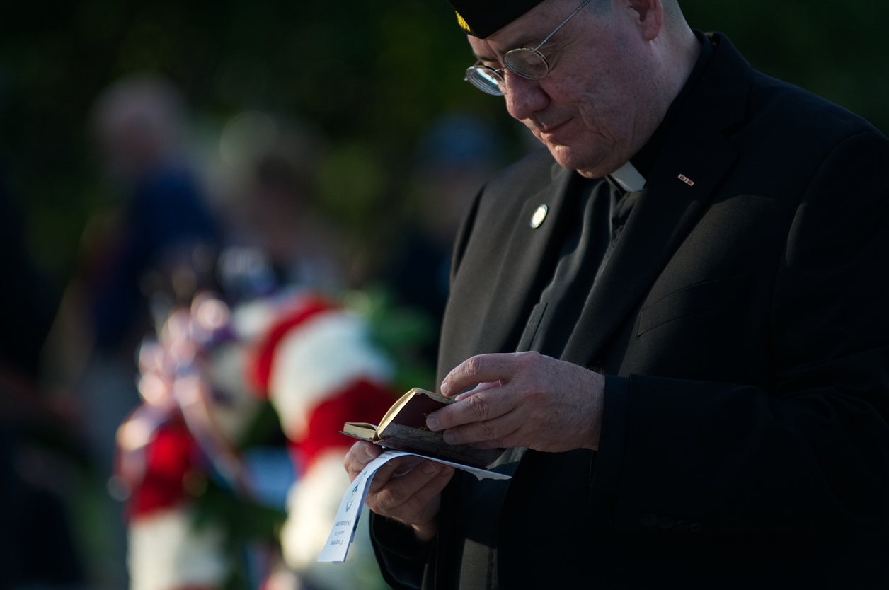 military chaplain holding bible