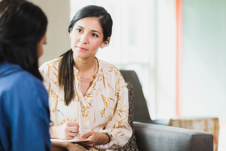 christian counselor talking with patient